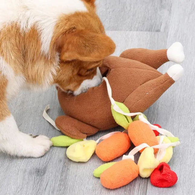 Dog playing tug with roast turkey snuffle toy
