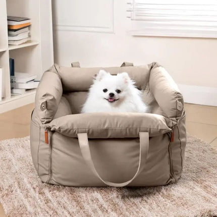 Fluffy white dog sitting comfortably in luxury beige pet car seat