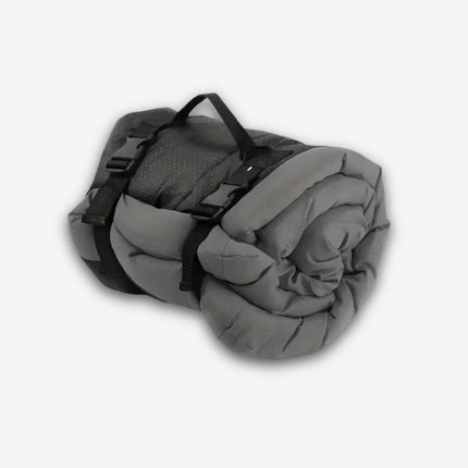 Foldable grey travel dog bed with buckles and handle