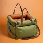 Green Dog Car Seat Carrier with Orange Interior and Safety Straps