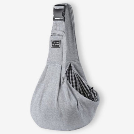 Grey dog sling carrier designed for convenience and comfort during travel