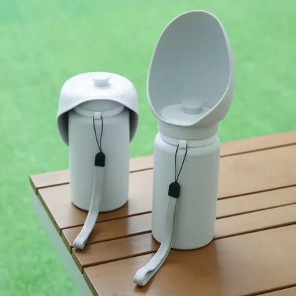 Two grey dog water bottles shown folded and open on wooden table